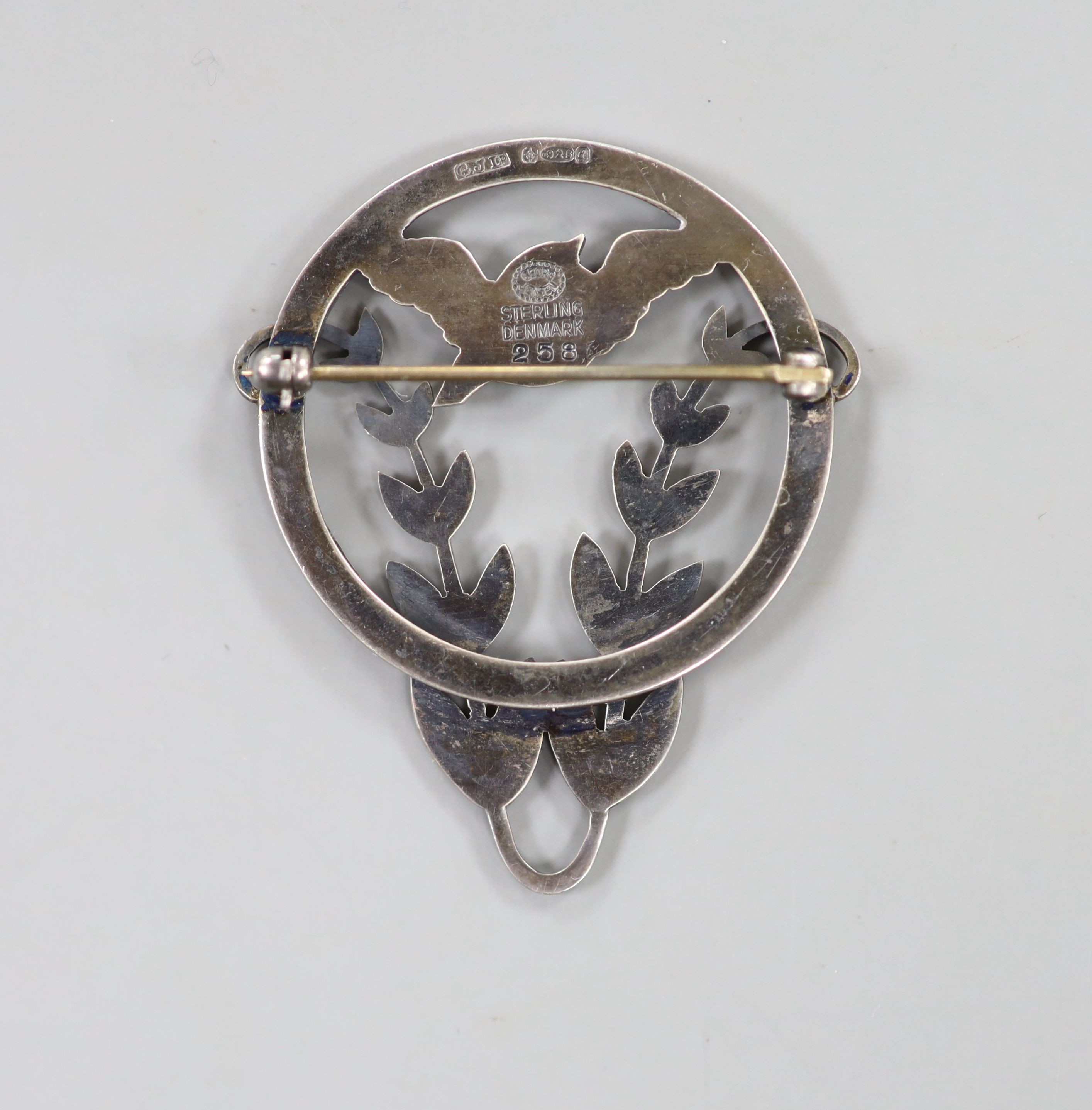 A Georg Jensen sterling robin and frond shaped circular brooch, no. 258, 43mm.